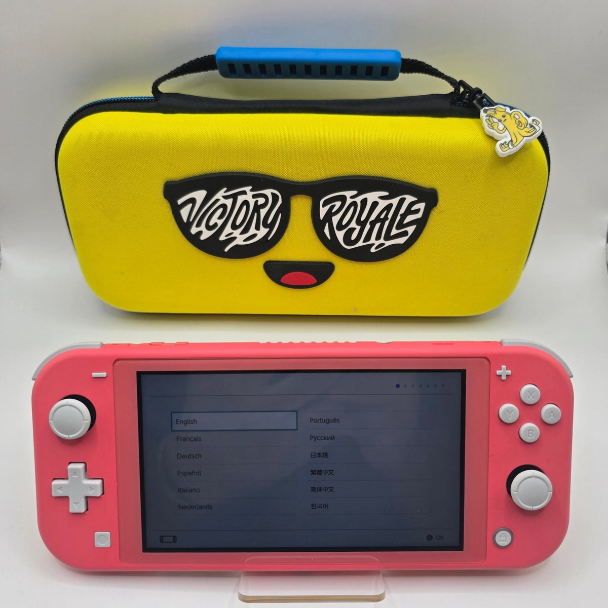 Nintendo Switch Lite 32GB (Coral) with Fortnite Peely Victory Royale Case